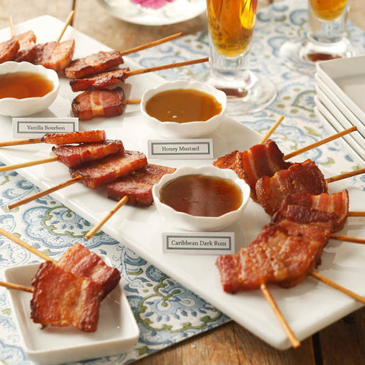 Bacon Lollipop Sampler with three sauces: Vanilla Bourbon, Honey Mustard, and Carribean Dark Rum.