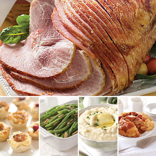 Artisan Spiral Sliced Ham Complete Dinner featuring Caramelized Onion & Feta Pastry Blossoms, Green Bean Almondine, Crème Fraiche Mashed Potatoes, and Caramel Apple Pie.